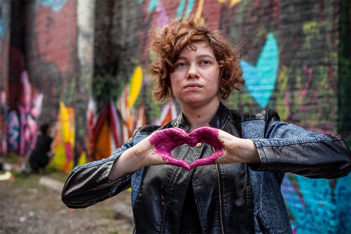 Girl holding hands like a heart