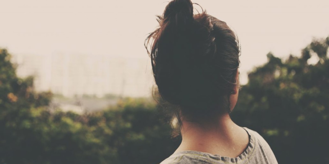 Photo of girl looking into the distance.