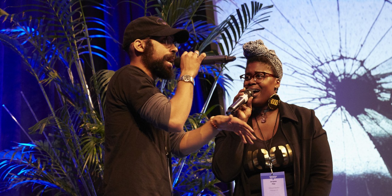 Two people signing on stage