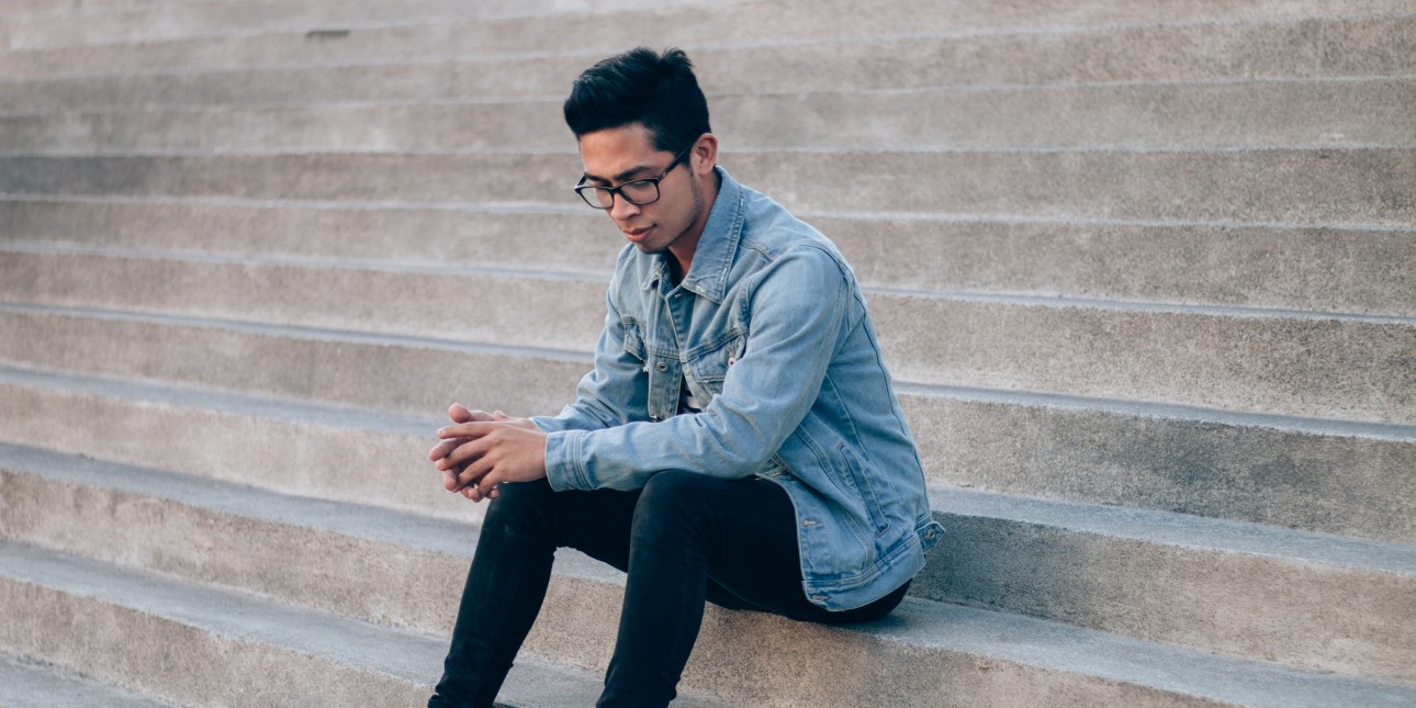 man sitting on stairs