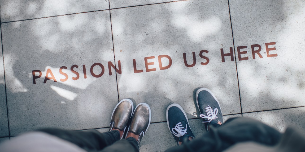 words on side walk, "passion led us here"
