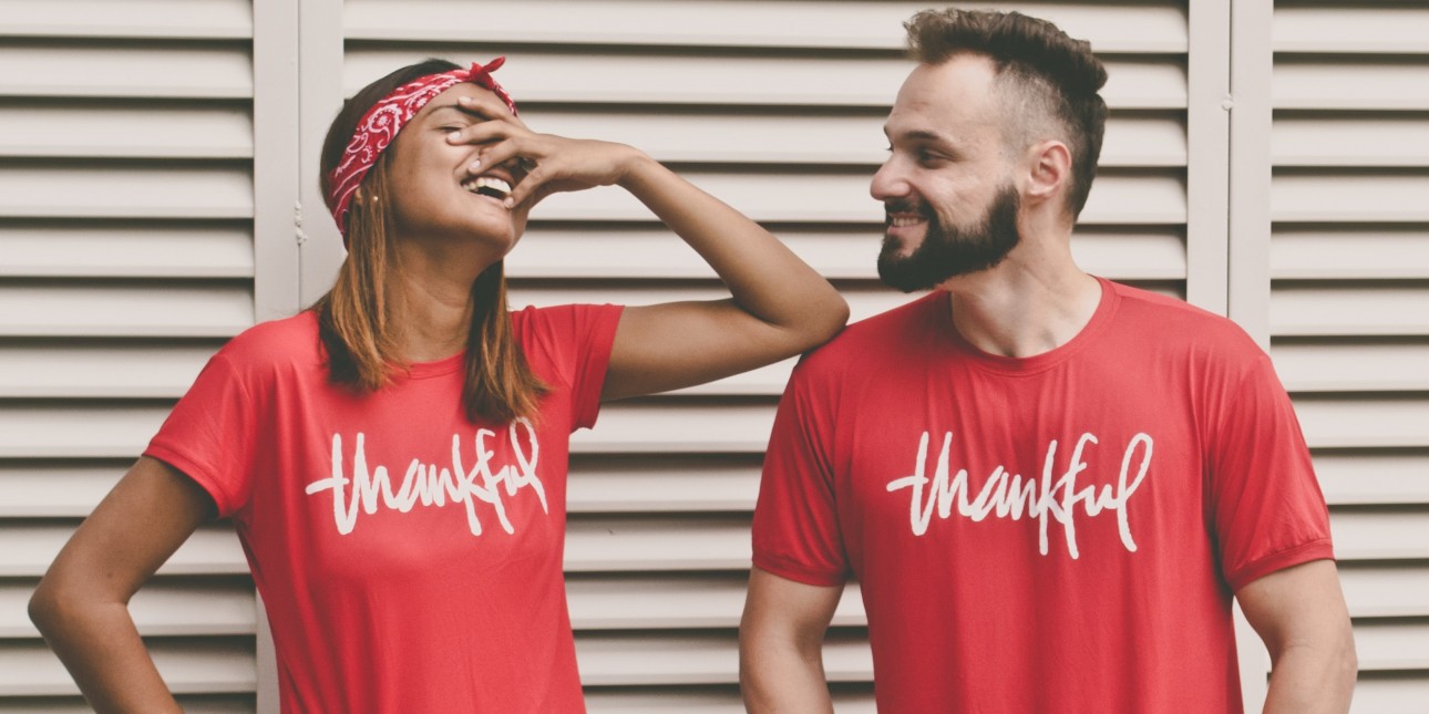 woman & man wearing "thankful" shirts