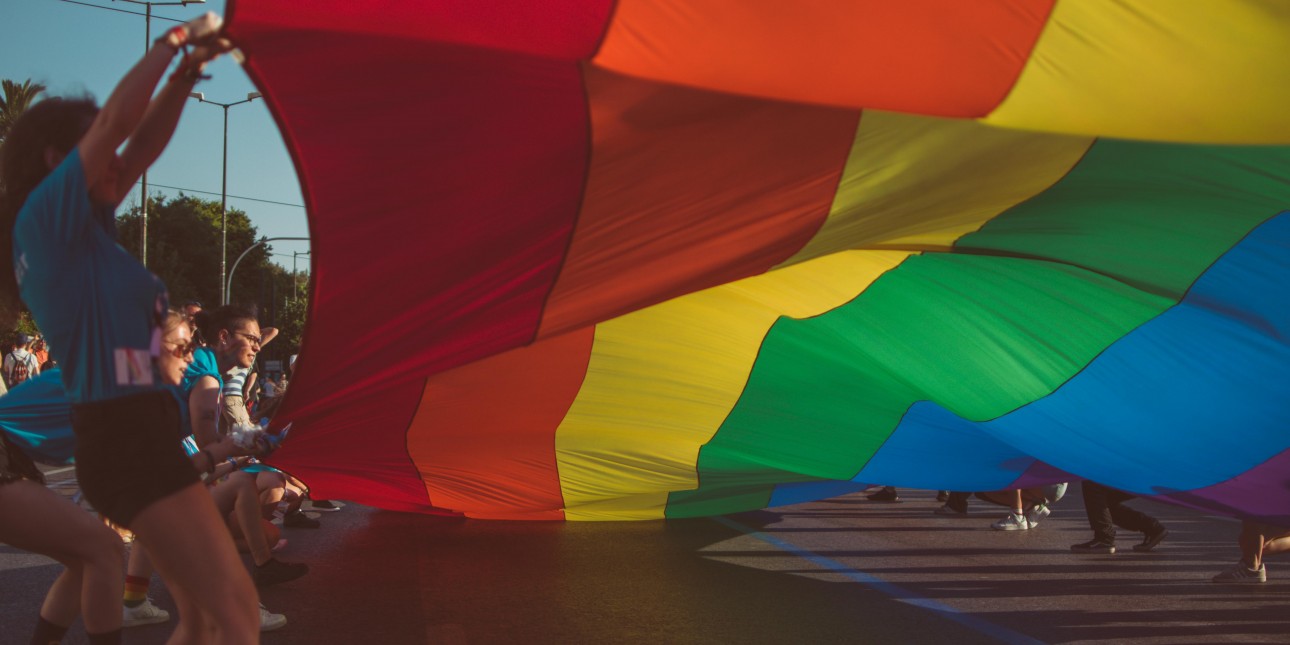 Young People Holding Up Large Pride Flag