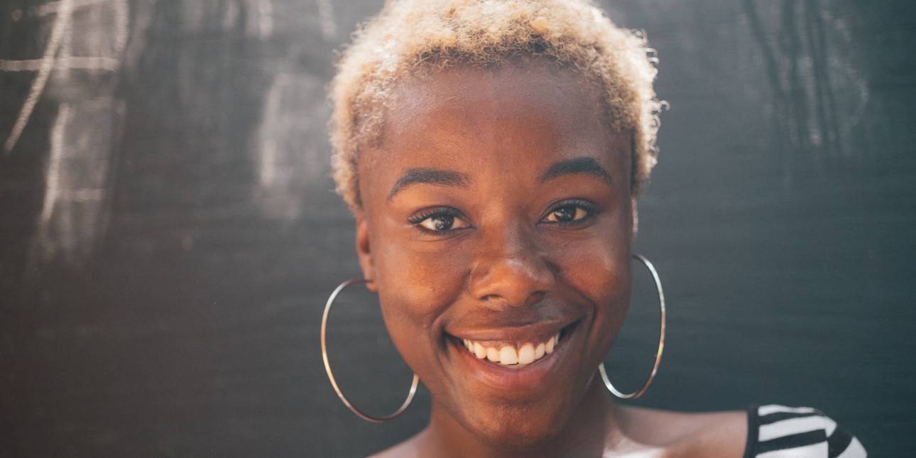 young adult black woman smiling