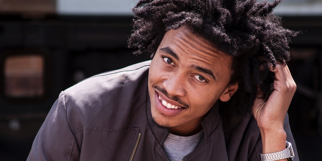 young man smiling looking at camera