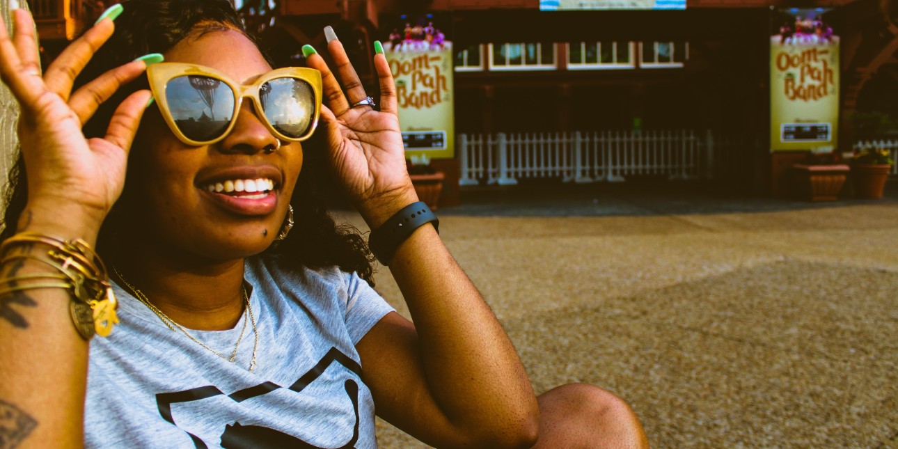 Person wearing sunglasses and smiling