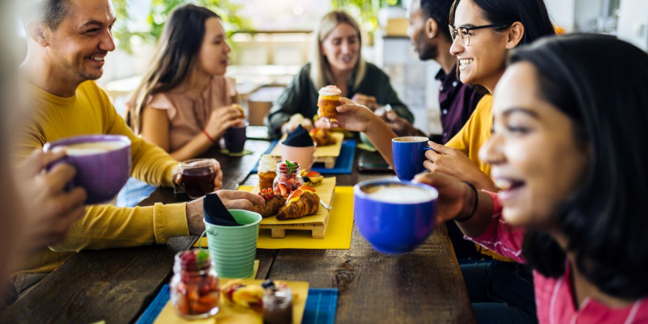 A table of people engaged with each other over a meal