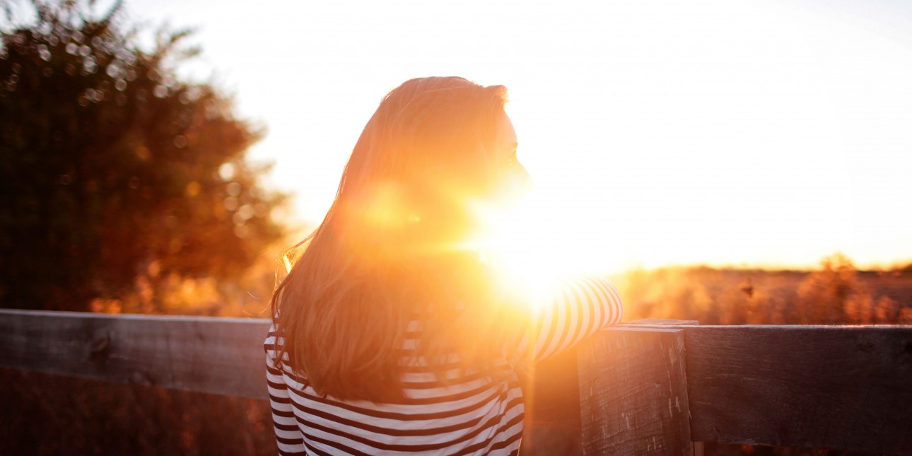 women standing in sun