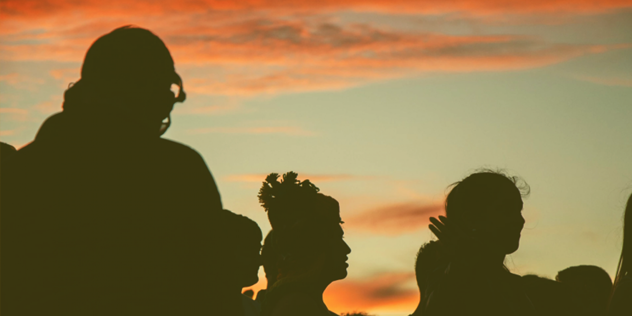 Group of young people at sunset