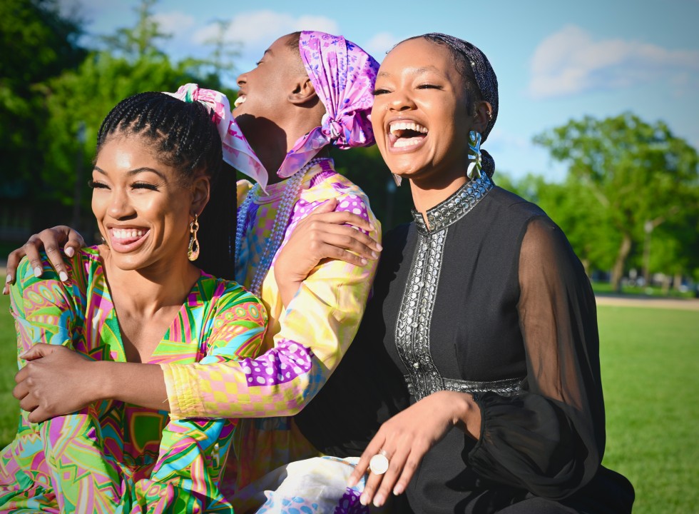 a group of 3 Black women smiling and laughing