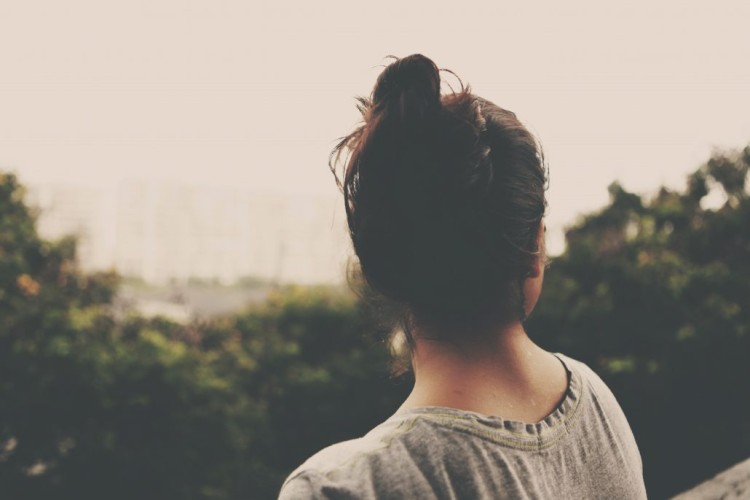 Photo of girl looking into the distance.