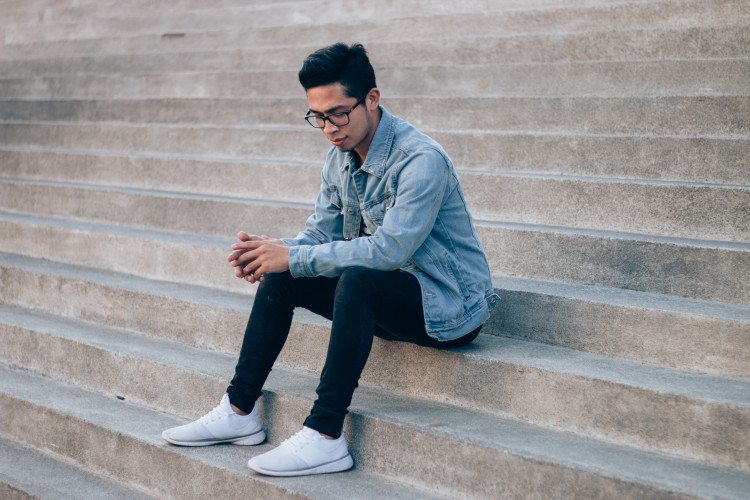 man sitting on stairs