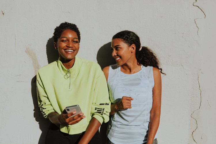 Two women laughing together