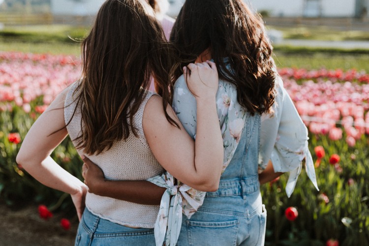 Young Teens looking at Spring Flowers