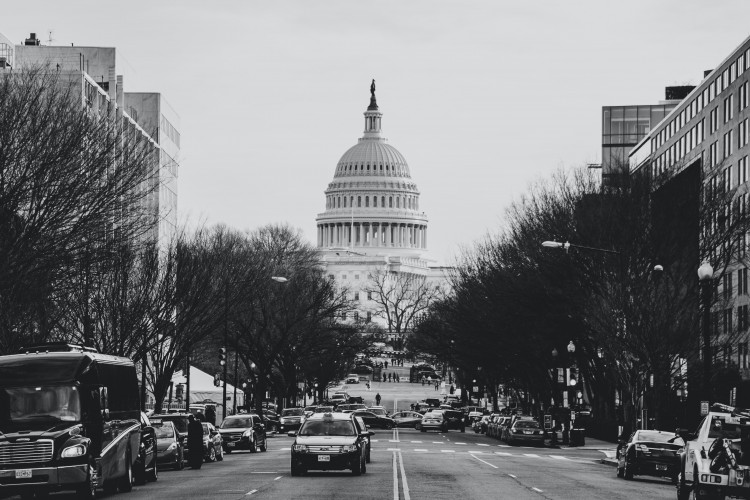 street view of U.S. capitol with cars