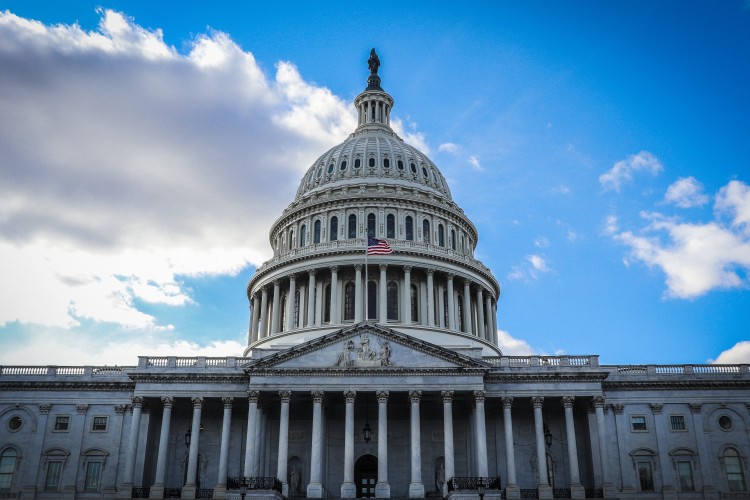 US Capitol with a blue sky and clouds