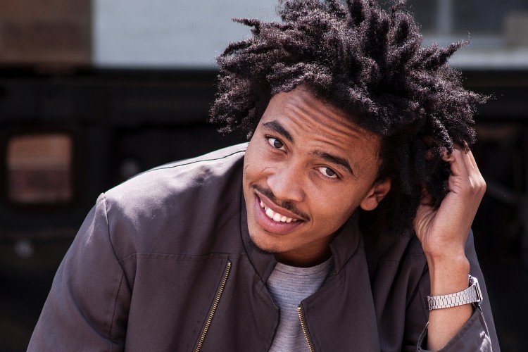 young man smiling looking at camera