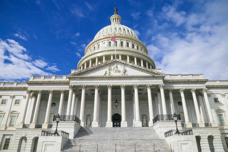 US Capitol with a blue sky and clouds