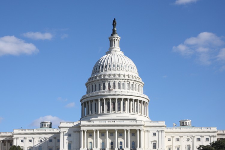 US Capitol with a blue sky and clouds