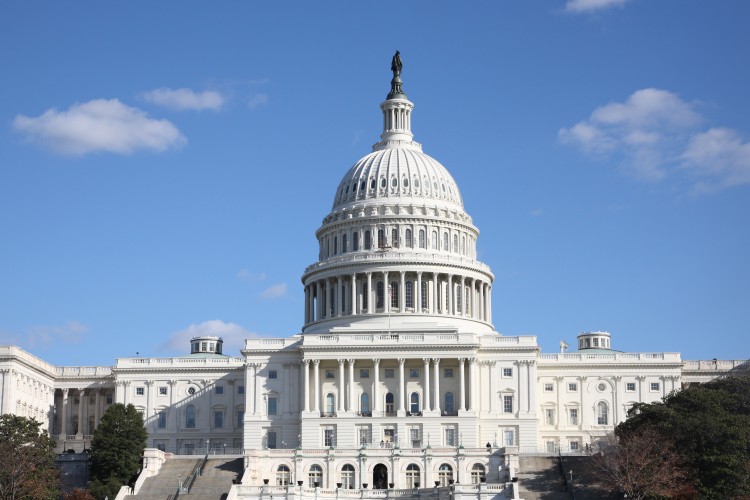 US Capitol with a blue sky and clouds