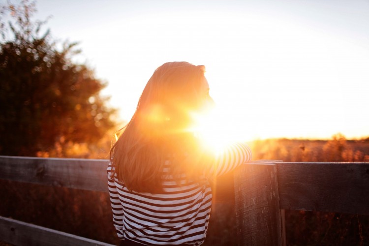 women standing in sun